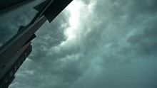 Heavy Clouds Above City, Storm, Hurricane Coming, Severe Weather Warning. Dark, Fast-moving Clouds, Evil Scene, Darkness Coming