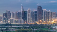 Jumeirah Lake Towers Skyscrapers And Golf Course Night To Day Timelapse, Dubai, United Arab Emirates