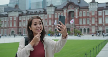 Canvas Print - Tourist take selfie on cellphone in Tokyo station