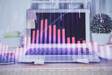 Stock market graph and table with computer background. Multi exposure. Concept of financial analysis.