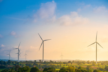 green energy concept, eco power. wind turbine located along the hill with the wind blowing all the t