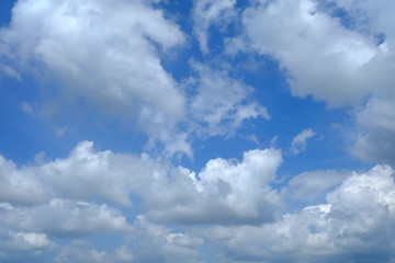 Wall Mural - White Clouds with Beautiful Blue Sky Background.