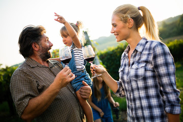 Wall Mural - Portrait of happy people spending time in vineyard