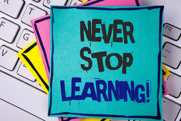 Handwriting text writing Never Stop Learning Motivational Call. Concept meaning Keep educating yourself Improve Skills written Sticky note paper placed Laptop Keyboard Sticky Note papers.