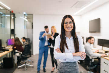 Wall Mural - Portrait of successful beautiful businesswoman in office