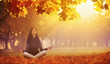 © Pasko Maksim  - Yoga Woman Meditating In Autumn Park.  Fall Scene