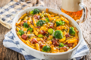 Wall Mural - Baked pasta penne with broccoli smoked pork neck mozzarela cheese and othe ingredients