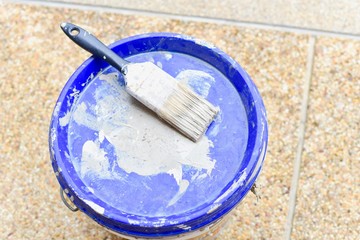 Paint Brush on Paint Bucket for DIY Project