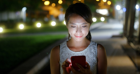 Poster - Woman use of mobile phone in city at night