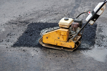 asphalt vibratory plate compactor. pothole repair process. asphalt tamping machine. pothole patching