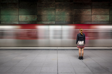 Wall Mural - Girl in front of passing underground train