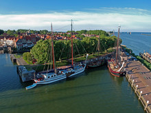 Drone Photo Of The Harbor Of Enkhuizen With Sailing Boats A Lock And Tower The Drommedaris And An Old White Drawbridge. 