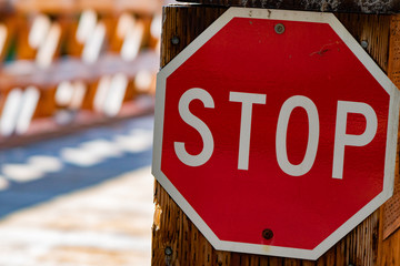 Stop Sign at a Wood Bridge