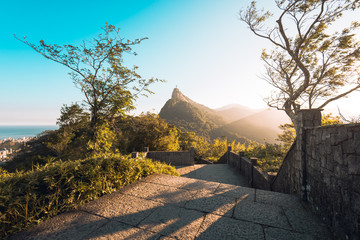 Fototapete - Beautiful Warm Sunset View in the Park With Corcovado Mountain in Rio de Janeiro