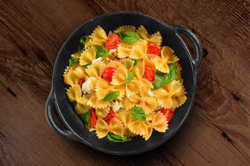 Wall Mural - Traditional Italian pasta on black rustic pan