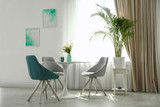 Fototapeta Lawenda - Modern living room interior with round table and stylish chairs