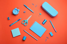 Different Bright School Stationery On Coral Background, Flat Lay