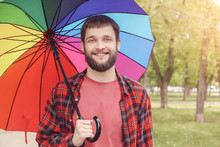 Handsome Man With Colorful Umbrella Outdoors