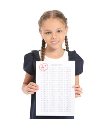 Wall Mural - Happy girl with answer sheet for school test on white background