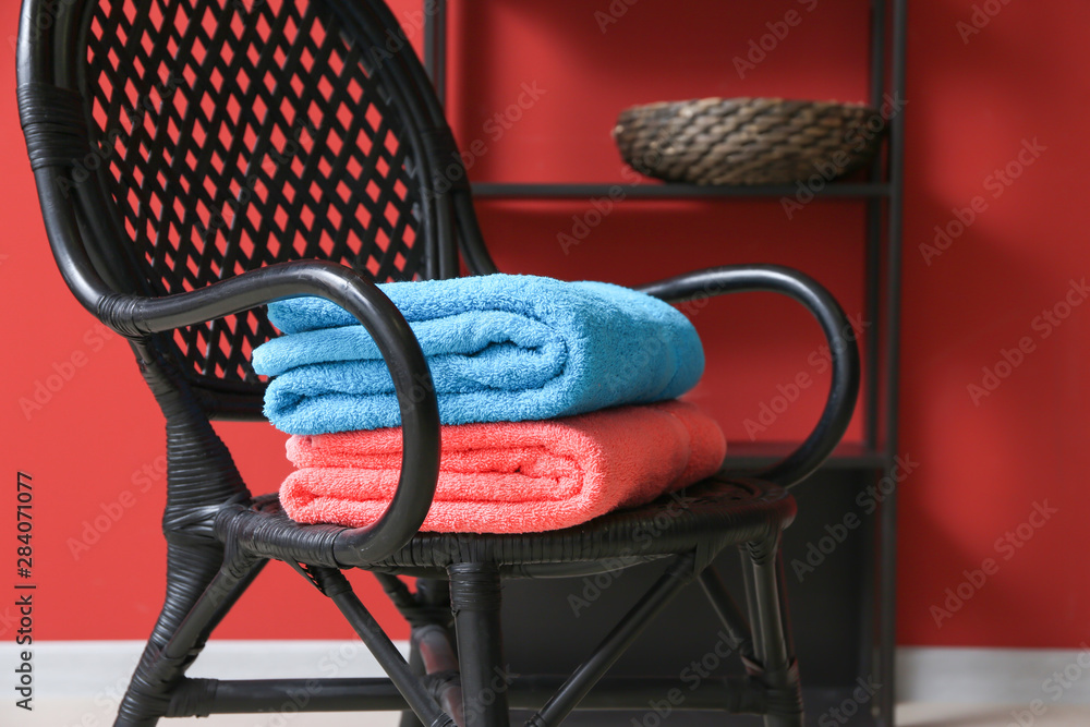 Clean soft towels on chair in room