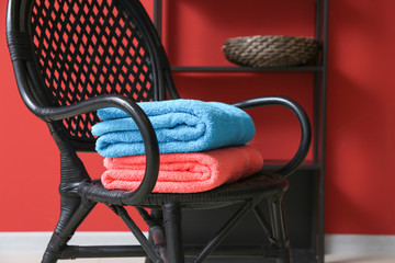 Poster - Clean soft towels on chair in room