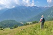 © Vedrana - Rear view of mature woman hiking in Brenta Dolomites