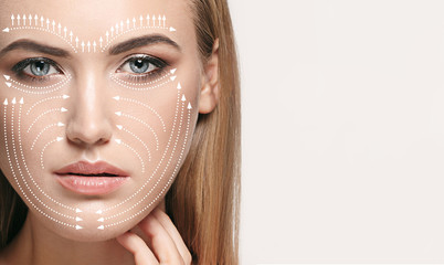 beautiful female face isolated on grey background. concept of bodycare, cosmetics, skincare and lift