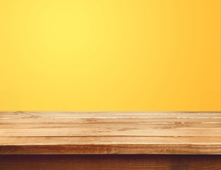 Poster - Empty wooden table on light yellow background