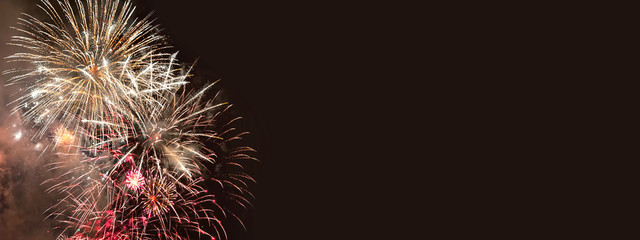 Wall Mural - fireworks on dark brown background for anniversary, new year and festivals