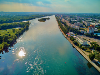 Wall Mural - UST-KAMENOGORSK, KAZAKHSTAN (QAZAQSTAN) - August 09, 2019: Beautiful panoramic aerial drone view to the confluence of the rivers Irtysh and Ulba in Oskemen