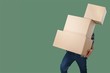 © BillionPhotos.com - Carrying man stack boxes delivery background copy
