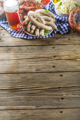 Wall Mural - Bavarian German holiday traditions. Oktoberfest food and beer glass mug. Background for congratulations with Oktoberfest, autumn restaurant menu.