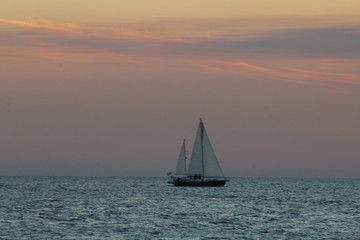  sailboat sailing after sunset