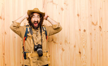 Young Crazy Explorer With Straw Hat And Backpack On Wood Backgro