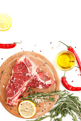 Wall Mural - Raw t-bone steak on a wooden board with rosemary and spices on a white background. Top view.