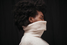 Portrait Of Woman With Lower Face Covered In Turtleneck Shirt