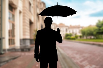 Wall Mural - Portrait of  businessman with umbrella on background