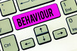 © Artur - Conceptual hand writing showing Behaviour. Business photo showcasing way in which one acts conducts oneself especially towards others Keyboard Intention to create computer message keypad idea