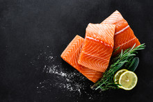 Salmon. Fresh Raw Salmon Fish Fillet With Cooking Ingredients, Herbs And Lemon On Black Background, Top View