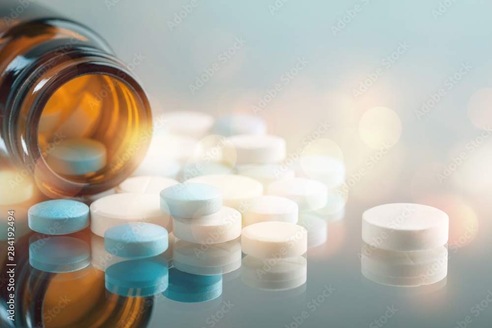 Colorful pills and tablets on background - obrazy, fototapety, plakaty 