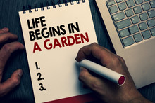 Text Sign Showing Life Begins In A Garden. Conceptual Photo Agriculture Plants Growing Loving For Gardening Written Words And Number On Notepad Man Hold Marker Keyboard On Wooden Desk