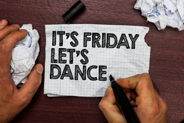 Conceptual hand writing showing It s is Friday Let s is Dance. Business photo text Celebrate starting the weekend Go party Disco Music Hand hold pen sketch word torn page woody deck hand paper ball