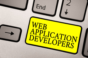 Word writing text Web Application Developers. Business concept for Internet programming experts Technology software Grey silvery keyboard with bright yellow color button black color texts