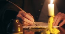 Close Shot Of 1700s Man Writing With A Quill Pen