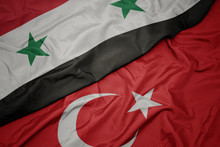 Waving Colorful Flag Of Turkey And National Flag Of Syria.