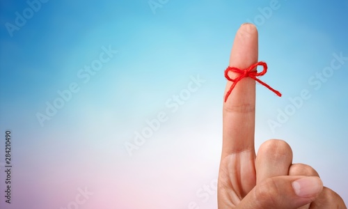 Fotomural Rope bow on finger pointing