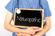 Doctor shows information on blackboard: naturopathic.  Medical concept.