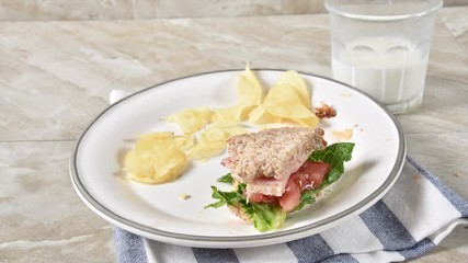 Canvas Print - Stop motion animation of a ham and swiss cheese sandwich being eaten