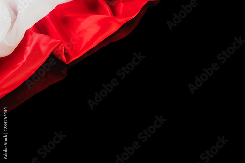 Fotografía Polish flag on a black background with reflection