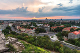 Fototapeta Miasto - Summer sunset. Photo from Nebet tepe Hill in Plovdiv city, Bulgaria. Panoramic view with warm sunset. Ancient Plovdiv is UNESCO's World Heritage.